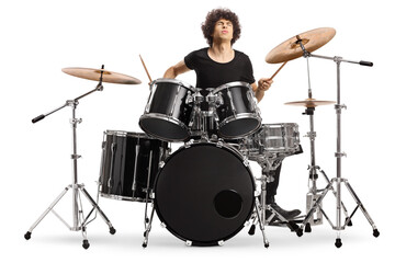 Young male drummer playing on stage