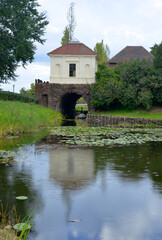 Fototapeta na wymiar Woerlitz, Germany, historical building water bridge, english gardens