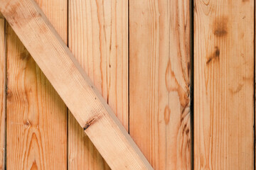 Pine wood vertical plank with diagonal jumper texture and background for text, carpenter construction