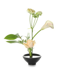Bowl with beautiful ikebana on white background