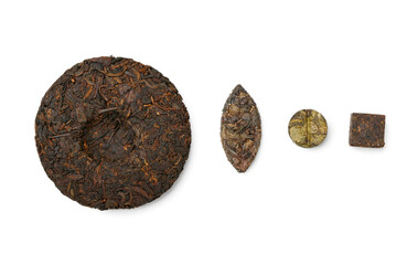 Composition with dry pressed puer tea on white background