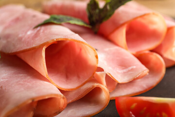Rolled slices of tasty ham, closeup