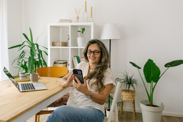 Lifestyle portrait of a businesswoman at home having a video call 