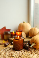 Thanksgiving autumn decor, burning candle, pumpkins and candles