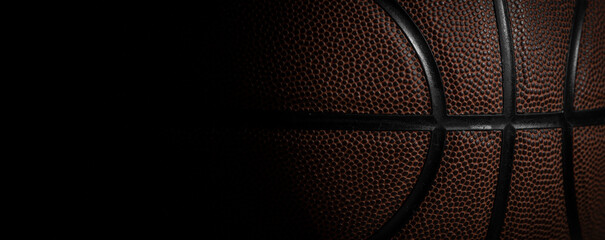 Closeup detail of basketball ball texture background. Horizontal sport theme poster, greeting...