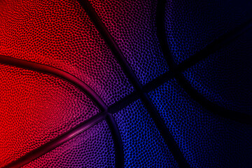 Closeup detail of basketball ball texture background. Neon banner art concept. Horizontal sport...