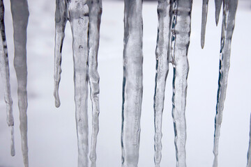 Large icicles against a white soft background