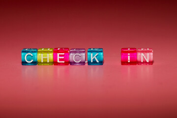 the word "check in" made up of cubes	