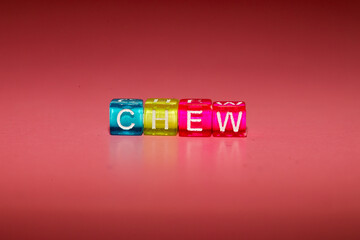the word "chew" made up of cubes	