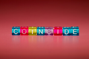 the word "coincide" made up of cubes