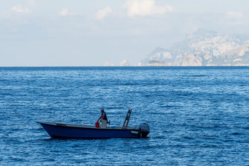 Boats in the Tyrrhenian sea by Amalfi Coast in Italy