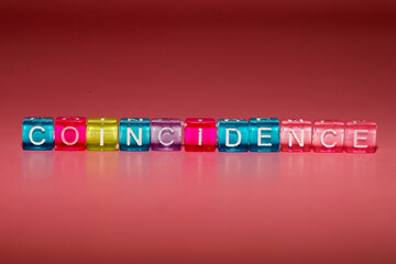 the word "coincidence" made up of cubes