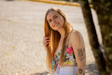Naklejka premium Beautiful woman in the park