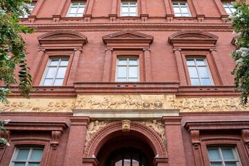 Exterior view of the National Building Museum, originally the Pension Building built in 1887, showing a frieze sculpted by Caspar Buberi depicting Civil War soldiers