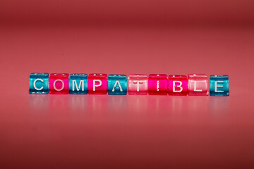 the word "compatible" made up of cubes