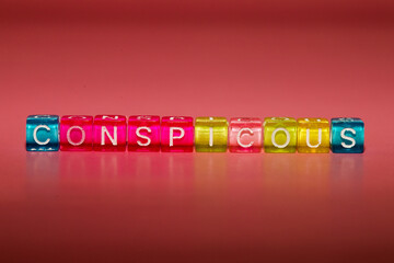 the word "conspitious" made up of cubes