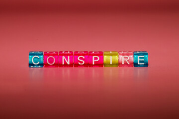 the word "conspire" made up of cubes