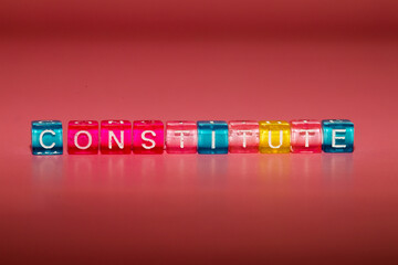 the word "constitute" made up of cubes