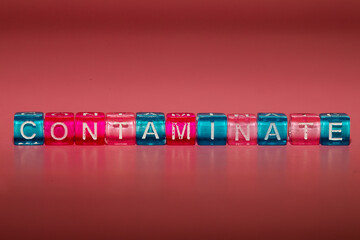 the word "contaminate" made up of cubes