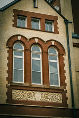 brown and tan brick building up-close - New Bern, NC