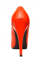 Bright red sexy stiletto heel. Rear view. It is isolated on a white background. Festive shoes.