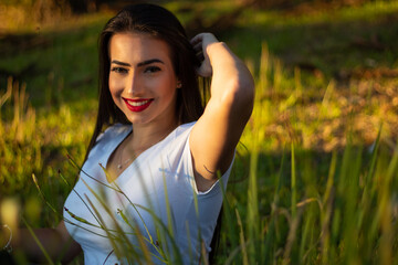 portrait of a beautiful brunette girl in the park