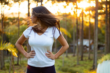 portrait of a beautiful brunette girl in the park