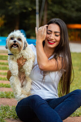 portrait of a beautiful brunette girl in the park