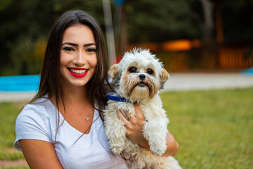 portrait of a beautiful brunette girl in the park