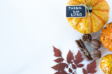 Autumn white background with pumpkin and leaves and a handwritten note: 