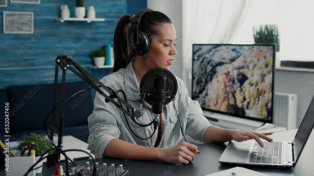 Sticker Radio talk show host answering audience questions on laptop while recording video. Creative content creator chatting with public on live chat while speaking on modern microphone.