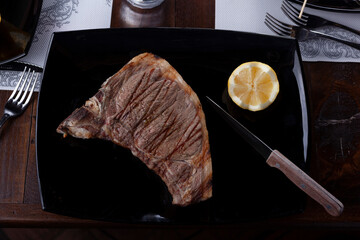 beefsteak grilled on a table of a restaurant - 532047807