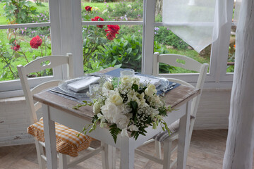 lunch set table in a bay window - 532048024