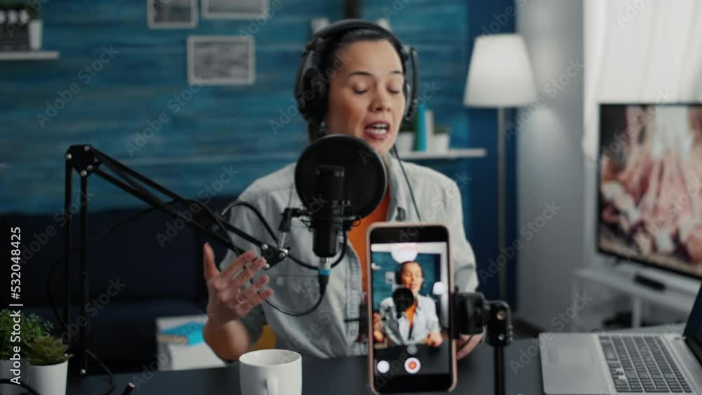 Poster popular content creator streaming live daily vlog using smartphone while talking to public. online l