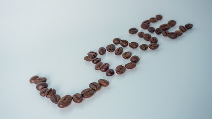 Coffee beans in shape of heart isolated on white background
