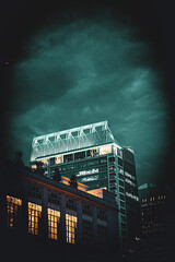 blue lit building at night portrait - Charlotte, NC