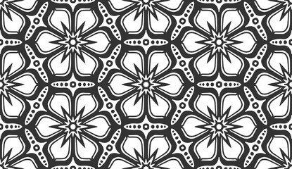 Seamless flower pattern. Abstract geometric floral black and white texture. Vintage fashion fabric ornament, carpet, wallpaper, packaging wrapping paper print. Monochrome lace hexagonal tile design