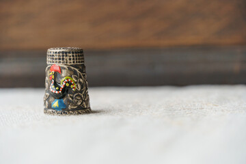 antique sewing thimble with art and ruby