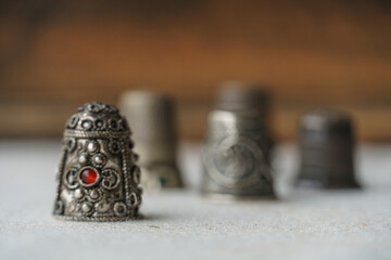 antique sewing thimble with art and ruby