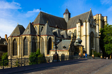 Fototapeta na wymiar Old town of Belgian city of Ghent with medieval Church of Saint Michael