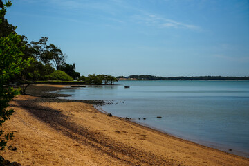View north from sandy shore at Redland Bay to Victoria Point, and Coochiemudlo Island in the...