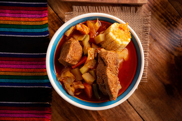 Mole de Olla. It is a balanced one pot meal, typical dish of the central region of Mexico, it is a soup-type stew based on beef and vegetables. It is consumed hot and accompanied with corn tortillas.