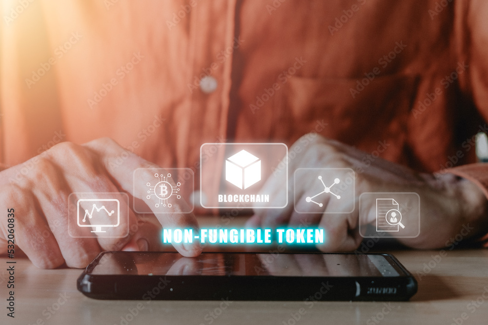 Aufkleber nft token digital crypto art blockchain technology concept, person hand using smartphone with nft ic
