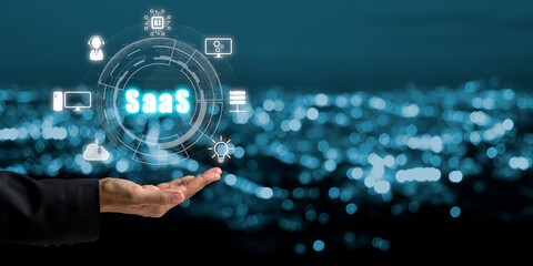 SaaS - software as a service, Businesswoman hand holding to synchronize on SaaS host server to working on system for technology and business concept