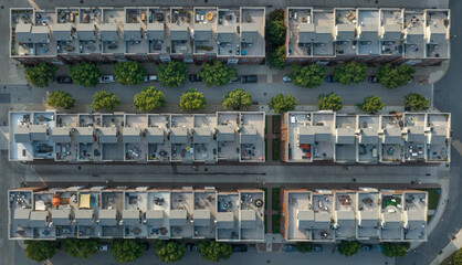 Aerial view of rows of rooftop patios on a new town house complex with garden furniture, patio...