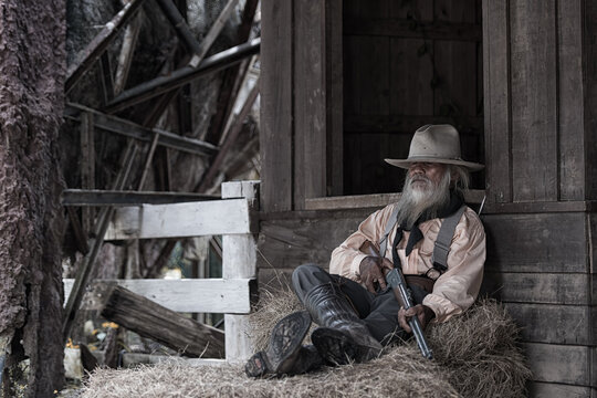 cowboy on farm. cowboy Sleep in farm with gun.