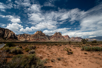 Desert mountains with intense clouds moving over landscape