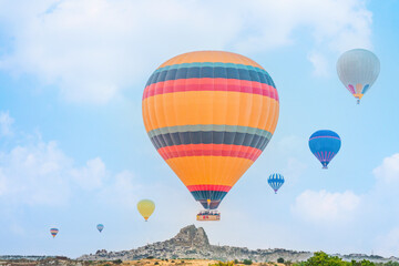Fototapeta na wymiar hot air balloons over Goreme town in Cappadocia Turkey