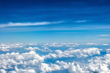 Fototapeta na wymiar Beautiful clouds seen from an airplane for background with copyspace