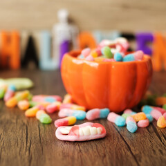 Happy Halloween day with ghost candies, pumpkin bowl, Jack O lantern and decorative (selective focus). Trick or Threat, Hello October, fall autumn, Festive, party and holiday concept